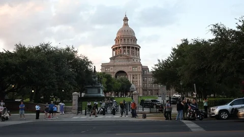 Motorcycles thunder past the Texas State Capitol Republic of Texas Biker Rally Stock Footage 102356789