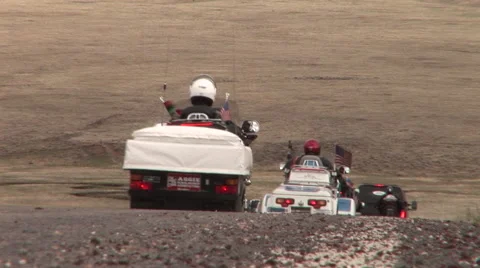Motorcycles with trailers drive away Video stock 41031118