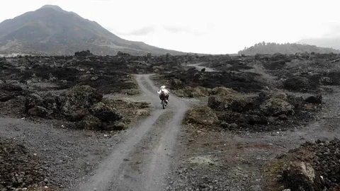 Motorcyclist on a background of mountains Stock Footage 112164423