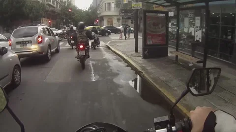 Motorcyclist captures robbery at traffic lights in Buenos Aires, Argentina Stock Footage 277097492