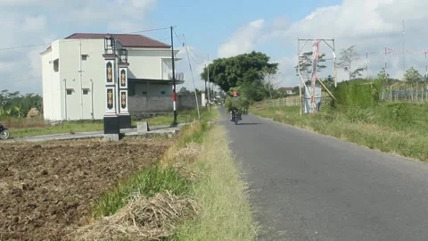 Motorcyclist carrying grass Stock Footage 242171359