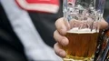 Motorcyclist drinking glass of beer, living biker lifestyle, male entertainment HD Footage