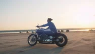 Motorcyclist Driving His Motorbike On The Road During Sunset Or Sunrise Stock Footage