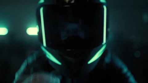 Motorcyclist with a Helmet Looking At Camera Stock Footage 263979987