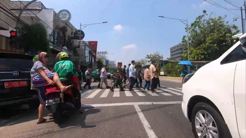 Motorcyclist Rides on a Beautiful Road in Jalan Ir H Juanda Jakarta Stock Footage