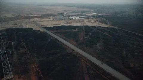 Motorcyclist rides on the road between the fields Vidéo 199002897