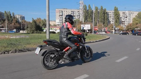 Motorcyclist rides on the road Stock Footage 101348556