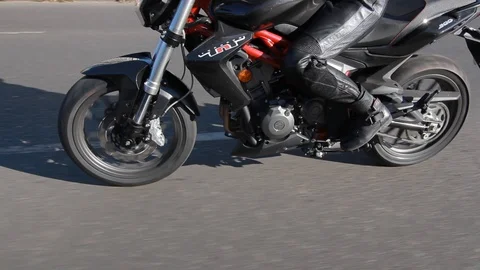 Motorcyclist rides on the road Stock Footage 101348723