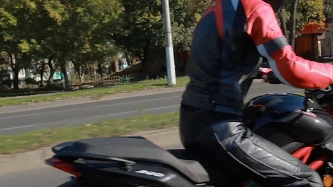 Motorcyclist rides on the road Stock Footage 101348797
