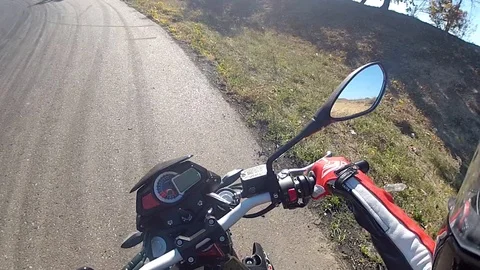 Motorcyclist rides on the road Stock Footage 101349688