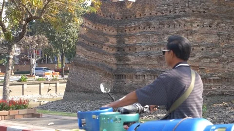 Motorcyclist slow motion drive at north corner of moat Stock-Footage 123725060