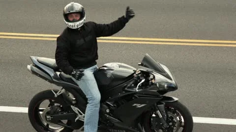Motorcyclist on Stopped on Road Stock Footage