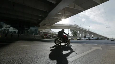 Motorcyclist stops at red light in Bucharest Romania Stock Footage 151415666
