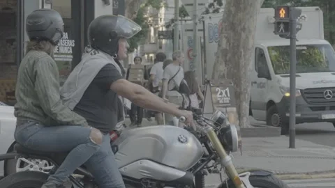 A motorcyclist waiting at a traffic light in Buenos Aires, Argentina Stock-Footage 345137983