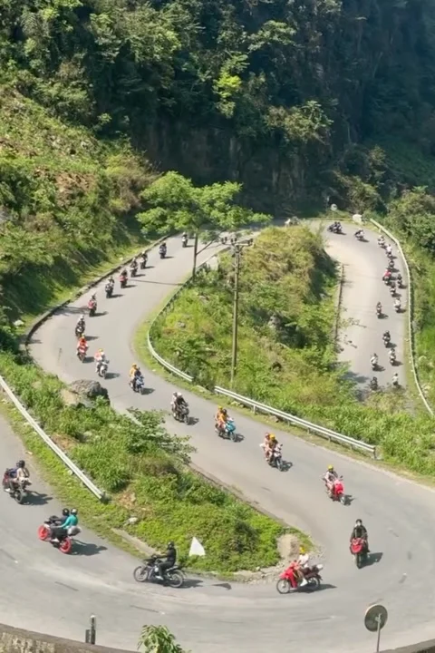 Motorcyclists Conquer Sharp Mountain Curves Together Stock Footage 320572457