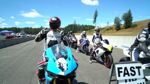 Motorcyclists get ready to race Stock Footage 126740082