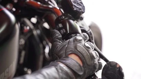 Motorcyclist's hand lay on accelerator handle on steering wheel. Footage. Man Stockbeeldmateriaal 147405282