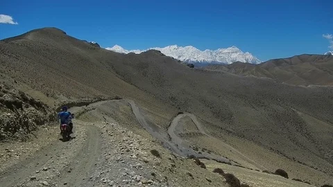 Motorcyclists on a mountain road Stock Footage 80275101