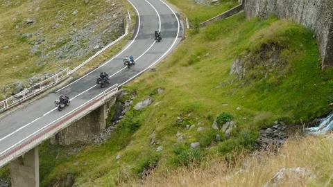 Motorcyclists on a mountain road Stock Footage 287253707
