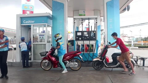 Motorcyclists refuel at gas stations Stock Footage 276154052