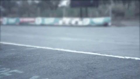 Motorcyclists riding through the straight portion in slow mo Stock-Footage 70324300