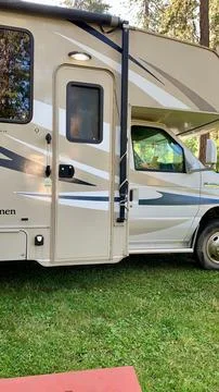 Motorhome in partial side view Stock Photos