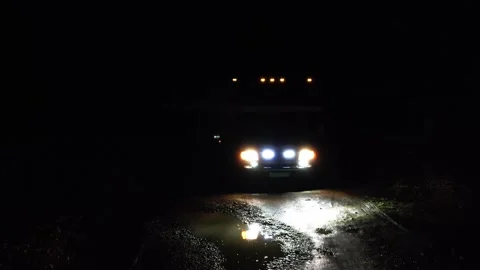 Motorhome rides at night on a poorly maintained road 库存影片 307955283