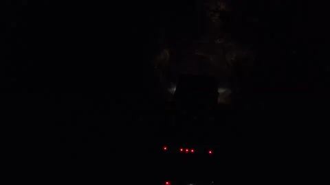 Motorhome rides at night on a poorly maintained road 库存影片 308033980