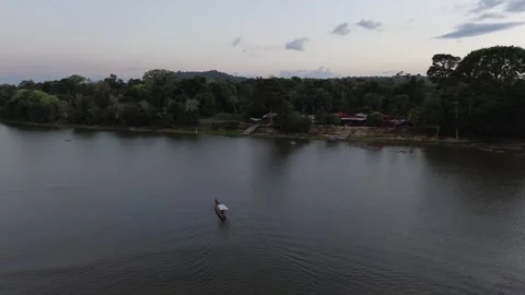Motorised canoe on Maroni river approaching the bank, Suriname Stock Footage 306868148