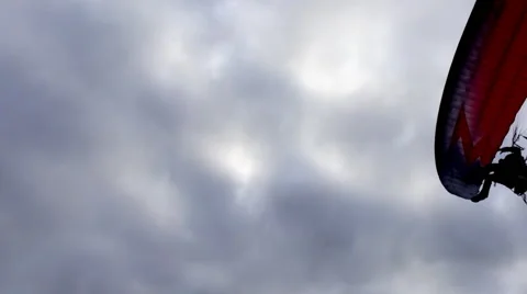 Motorised paraglider powers overhead Stock Footage 59603507