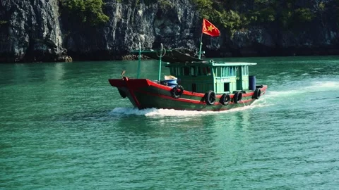 Motorized Boat Navigating Turquoise Waters at Ha Long Bay Vietnam Video stock 340023566