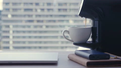 Motorized dolly shot of making coffee at office break 스톡 동영상 190810697