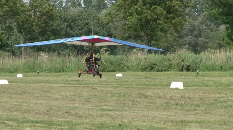 Motorized hang glider taking off Stock Footage 36773197
