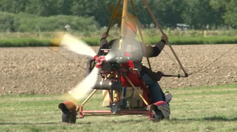 Motorized hang glider taking off Stock Footage 36773241