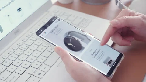 Motorized jib shot of browsing the Google Store on Pixel 7 Pro smartphone Stock Footage 219767422