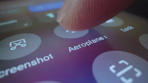 Motorized macro moving shot of switching smartphone to airplane mode Stock Footage 217422726