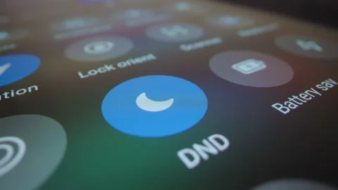 Motorized macro moving shot of switching smartphone to do not disturb mode Stock Footage 218346836