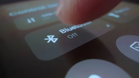 Motorized macro moving shot of turning on Bluetooth on a smartphone Stock Footage 217422899