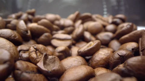 Motorized moving shot of coffee beans in a glass jar Stock Footage 136211593