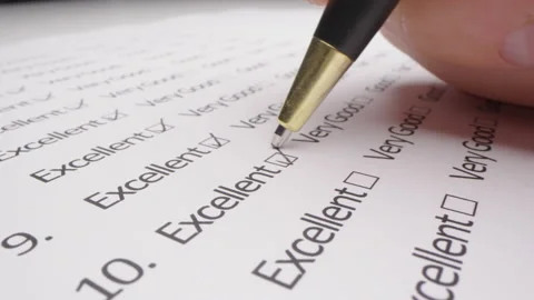 Motorized moving shot of completing an evaluation form Stock Footage 148186514