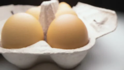 Motorized moving shot of eggs in egg carton Stock Footage 199184368