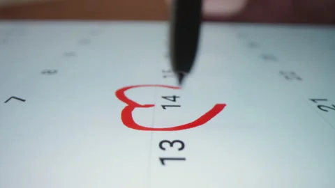 Motorized moving shot of marking reminder for Valentine's Day in a calendar app Stock Footage 224626970