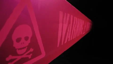 Motorized moving shot of warning tape against dark background Stock Footage 150418438