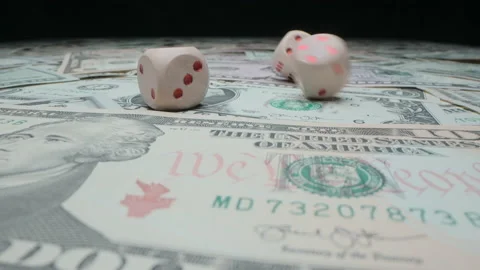 Motorized moving slow motion shot of throwing dice on US dollar banknotes Stock Footage 140626707