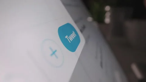 Motorized moving slow motion shot of clicking the tweet button in Twitter Stock Footage 142340305