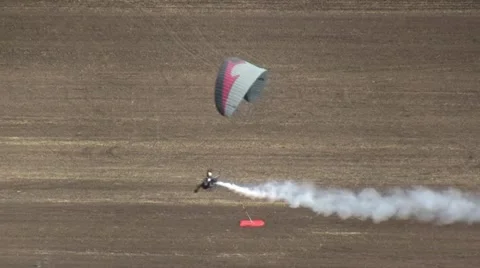 Motorized parachute hits the target during competition of ultralight airplanes Stock Footage 18122698
