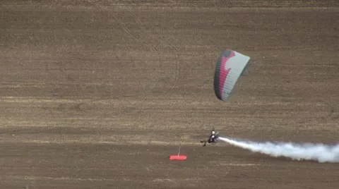 Motorized parachute hits the target during competition of ultralight airplanes Stock Footage 18123693
