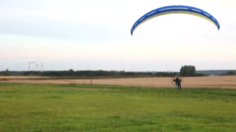 Motorized paraglider in the falling eveninglight Stock Footage 40462097