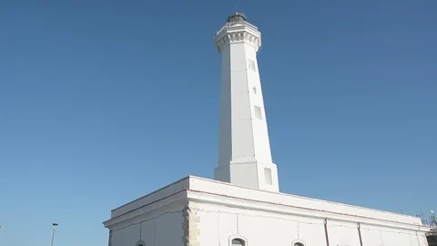 Motorized paraglider flies over lighthouse Stock Footage 71648969