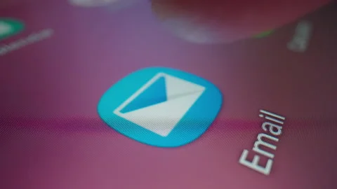 Motorized slow motion moving shot of clicking Email app icon in a tablet Stock Footage 196851013